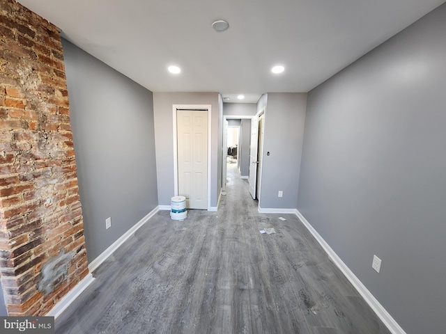 empty room featuring dark wood-type flooring