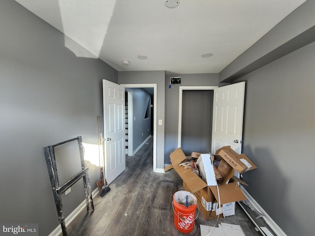 interior space with dark hardwood / wood-style flooring