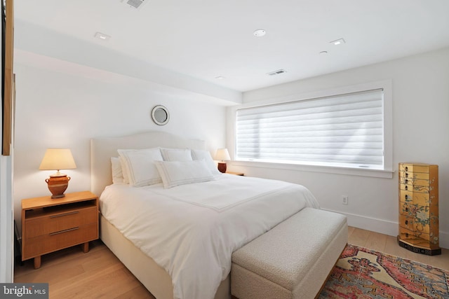 bedroom with light wood-type flooring