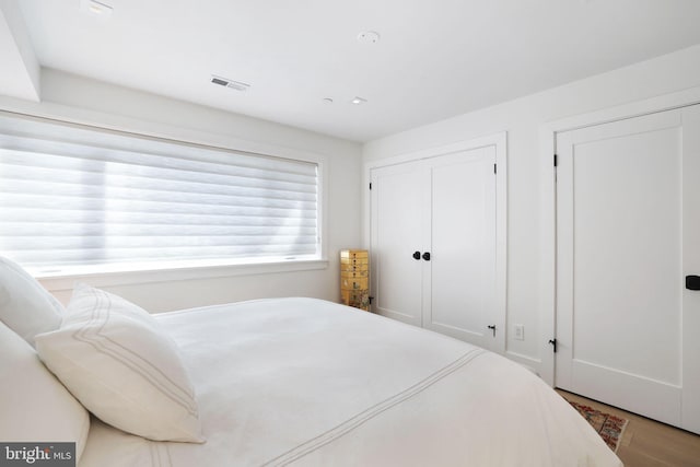 bedroom featuring hardwood / wood-style flooring