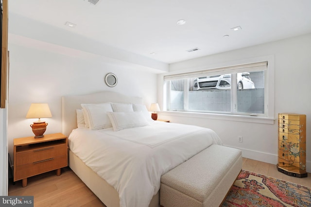 bedroom with light hardwood / wood-style flooring