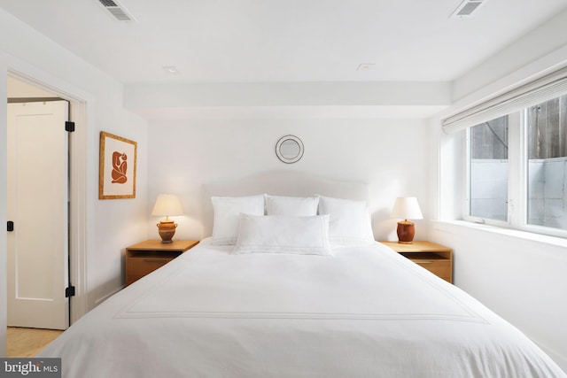 bedroom with light hardwood / wood-style floors