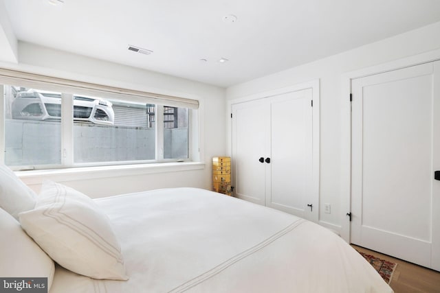 bedroom with wood-type flooring