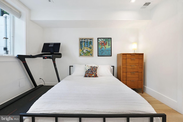 bedroom featuring wood-type flooring