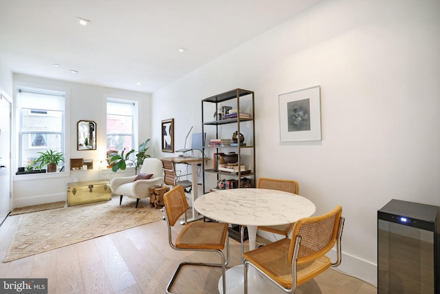 dining area with light hardwood / wood-style floors