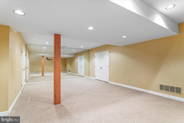 basement with light carpet