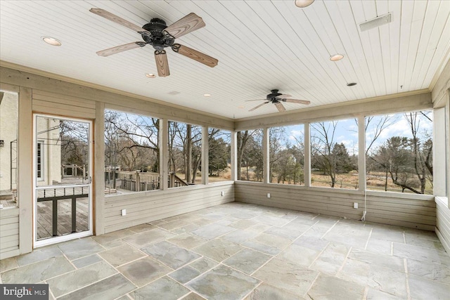 unfurnished sunroom with a wealth of natural light and wooden ceiling