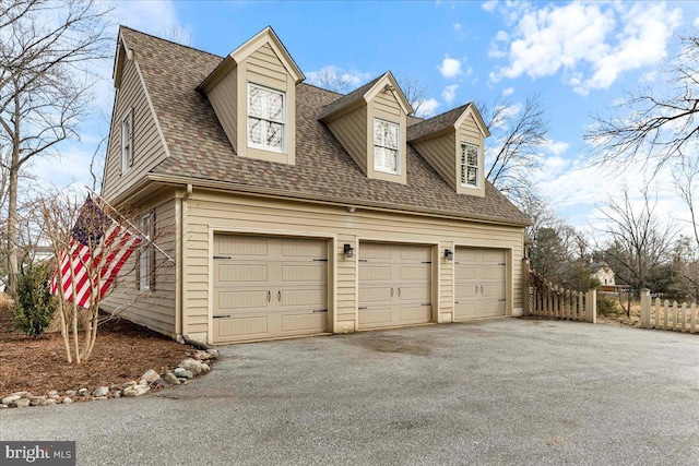 view of side of home with a garage