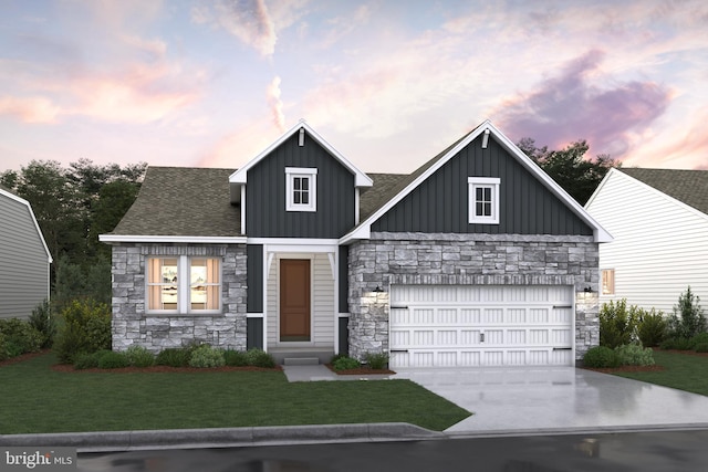 view of front of property with a lawn and a garage