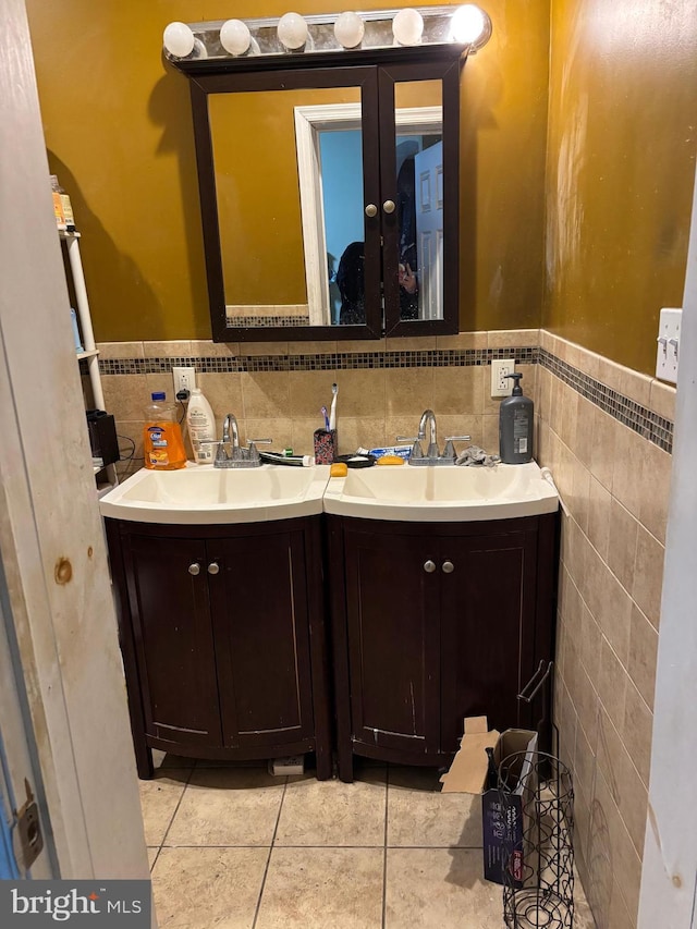 bathroom featuring tile patterned floors, vanity, and tile walls