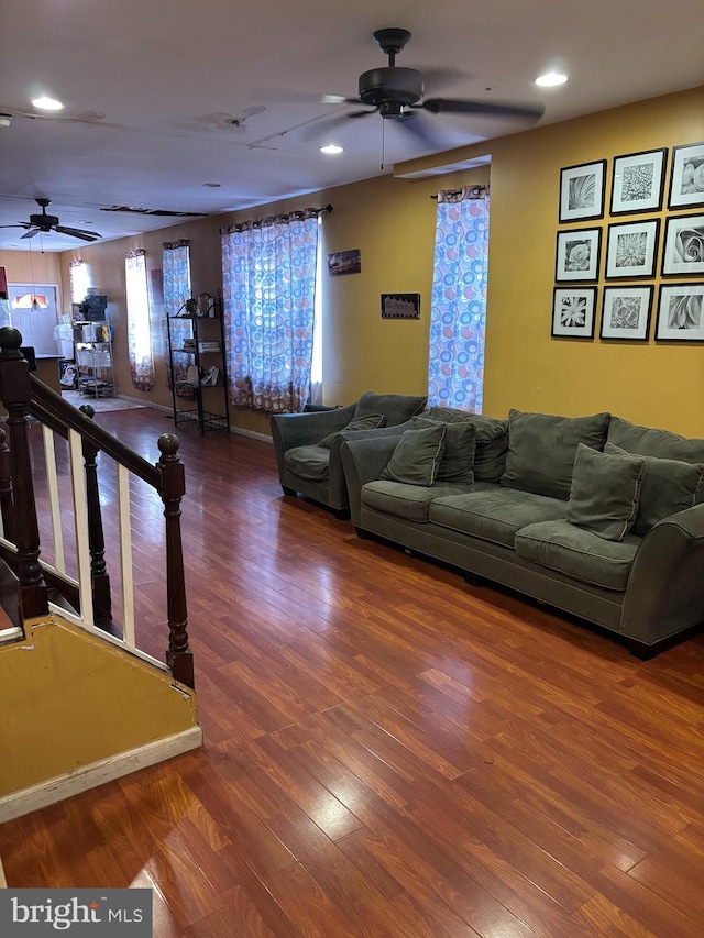 living room with hardwood / wood-style floors and ceiling fan