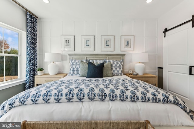 bedroom with a barn door