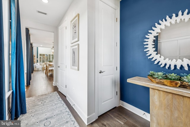 hall featuring dark wood-type flooring