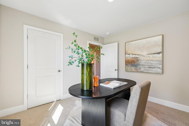 view of carpeted dining area