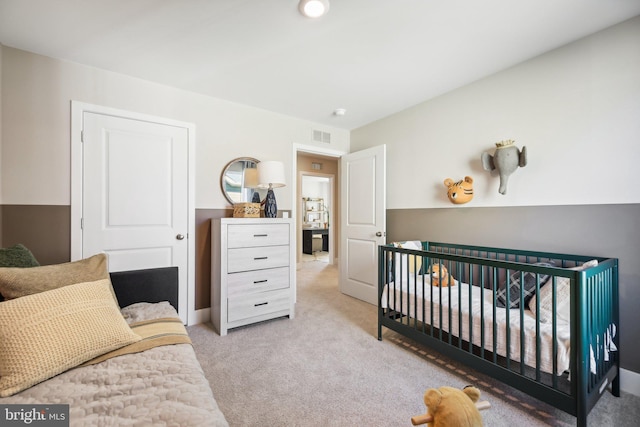 bedroom with light carpet