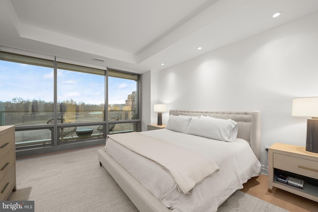 bedroom with floor to ceiling windows