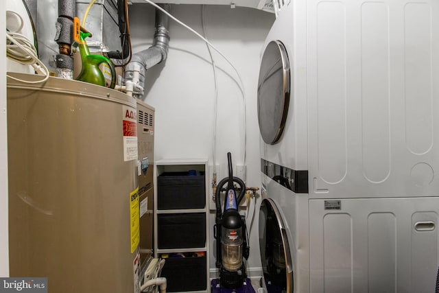 utilities featuring water heater and stacked washer and dryer