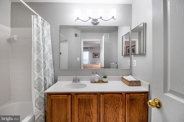 bathroom featuring vanity and shower / tub combo