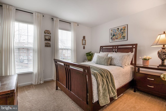 bedroom with light carpet