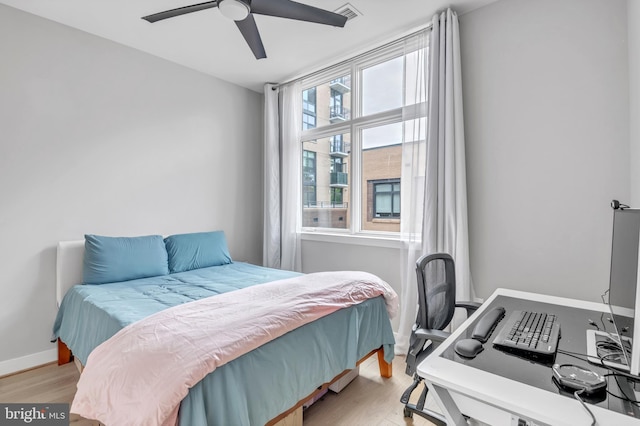 bedroom featuring ceiling fan and light hardwood / wood-style floors