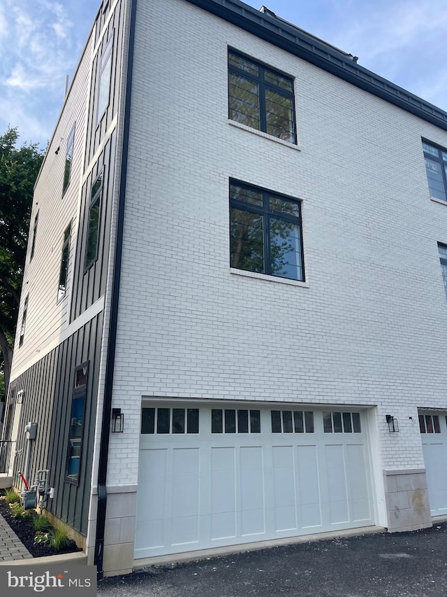 view of property exterior featuring a garage