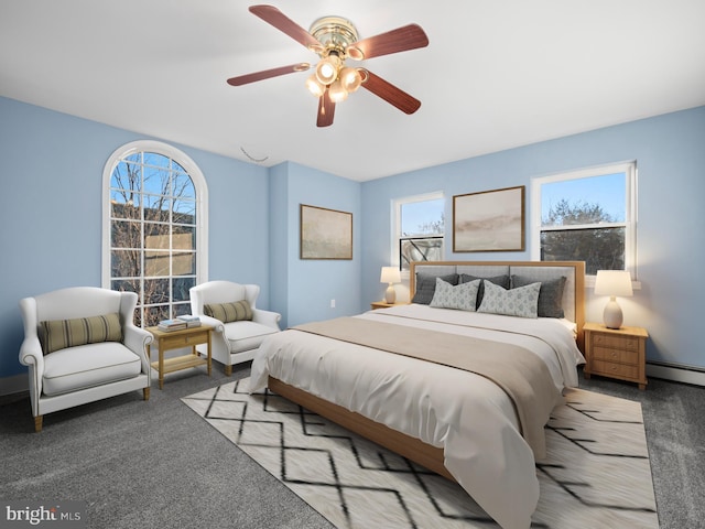 bedroom featuring ceiling fan, baseboard heating, and light carpet