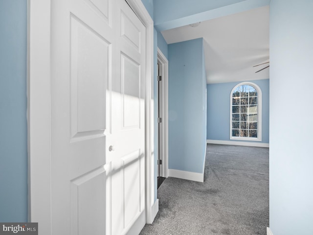 hallway featuring light carpet