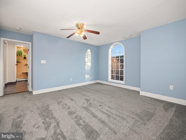 unfurnished room with carpet and ceiling fan