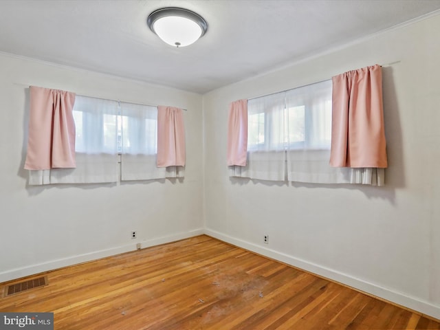 empty room with hardwood / wood-style floors