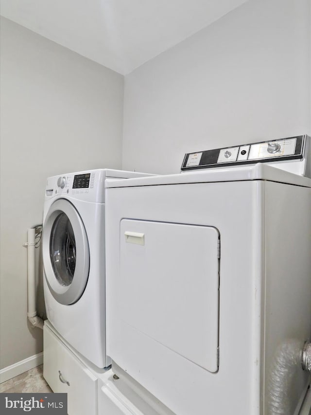 washroom featuring independent washer and dryer