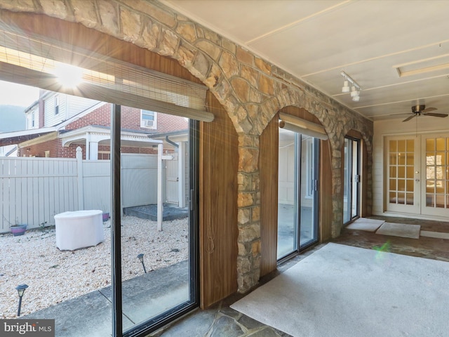 entryway featuring ceiling fan and french doors