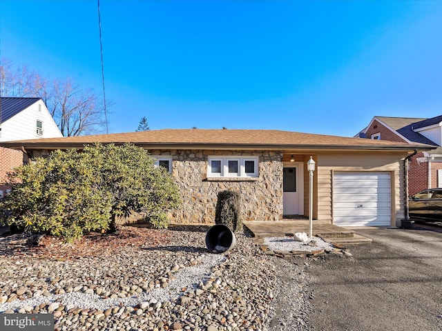 single story home with a garage