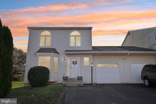 view of front of home with a garage