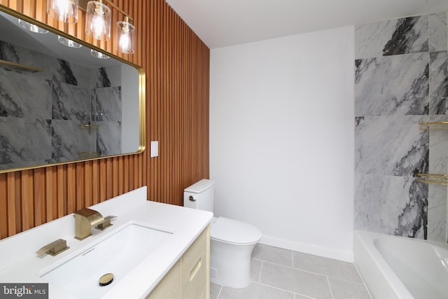 bathroom featuring tile patterned floors, vanity, toilet, and wooden walls