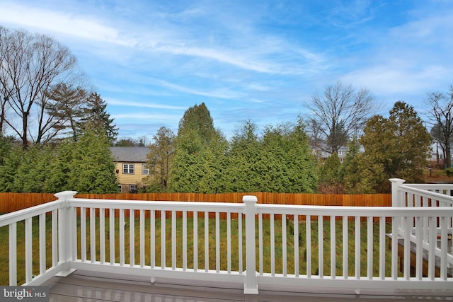 wooden deck with a yard