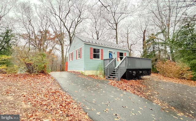 view of front of home featuring a wooden deck