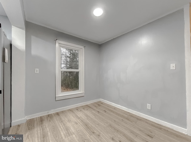 empty room with light hardwood / wood-style floors