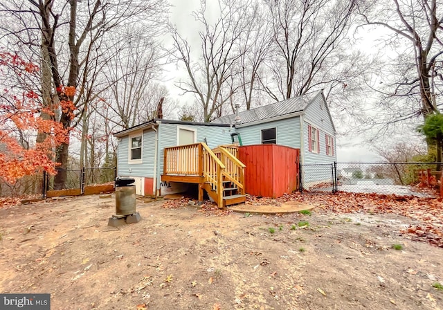 back of property with a deck