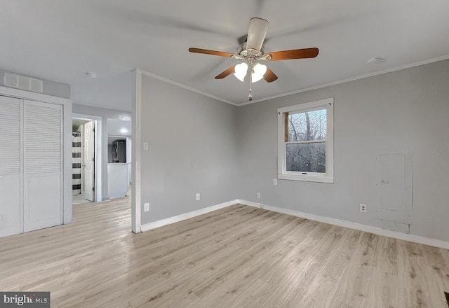 unfurnished room with crown molding, ceiling fan, and light hardwood / wood-style floors