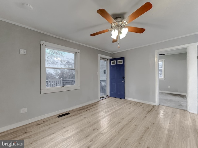 unfurnished room with light hardwood / wood-style flooring, ceiling fan, and crown molding