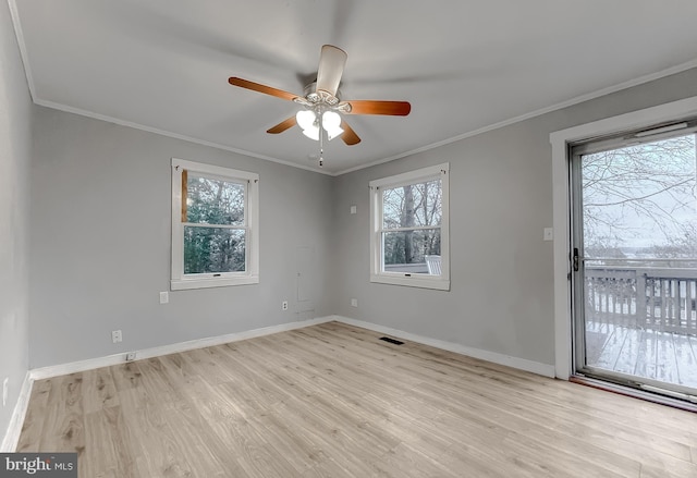 unfurnished room with ceiling fan, light hardwood / wood-style flooring, a healthy amount of sunlight, and ornamental molding