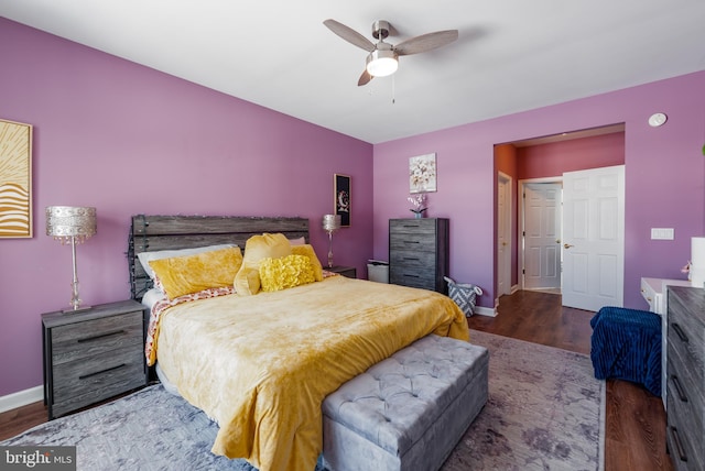 bedroom with ceiling fan and dark wood-type flooring