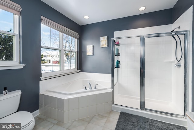 bathroom featuring toilet, tile patterned floors, and independent shower and bath