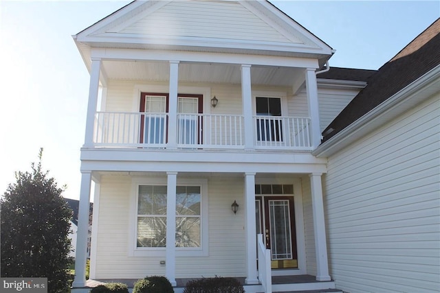 view of front of house featuring a balcony