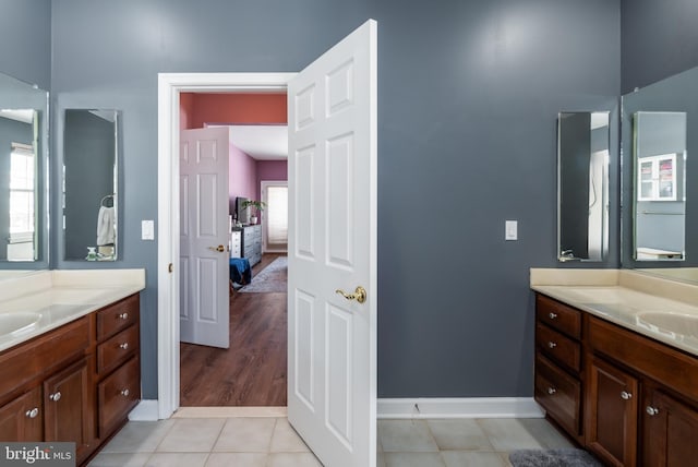 bathroom with tile patterned flooring and vanity