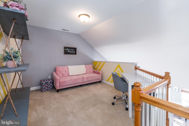 carpeted office featuring vaulted ceiling