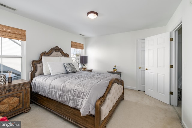 bedroom with light carpet