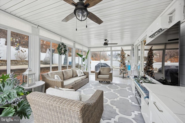 sunroom / solarium with an AC wall unit and ceiling fan