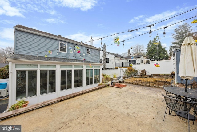 rear view of house with a patio