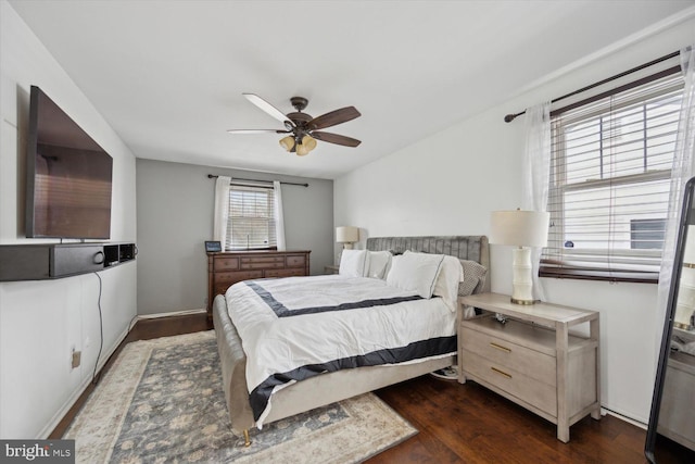 bedroom featuring dark hardwood / wood-style floors and ceiling fan